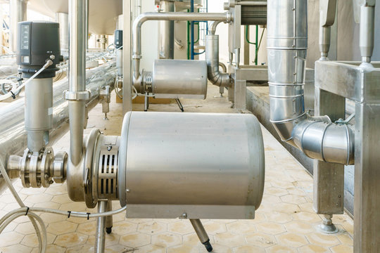metallic plate in heat exchange machine and pump in the food industrial plant