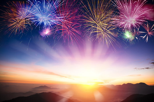  mountain with sunrise and fireworks background