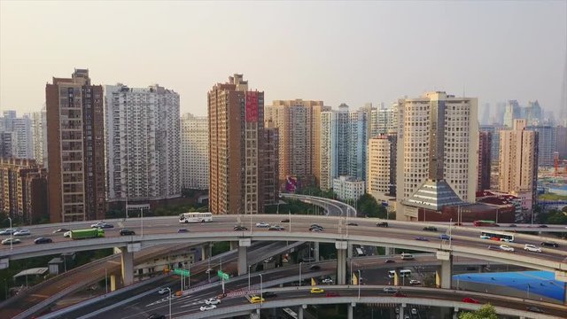 sunny day shanghai cityscape traffic round road junction aerial panorama 4k china
