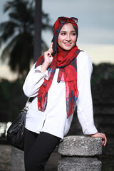 young beautiful muslim woman at the park in evening