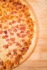 Pizza on wooden board