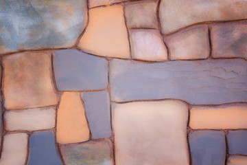 Wall bricks arranged in a colorful and beautiful. The old wall flap and a variety of colors in the background.