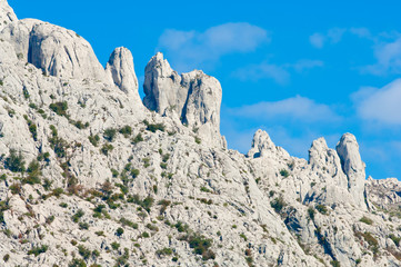 Adriatic coastal region in Dalmatia, Croatia with white, rocky mountains