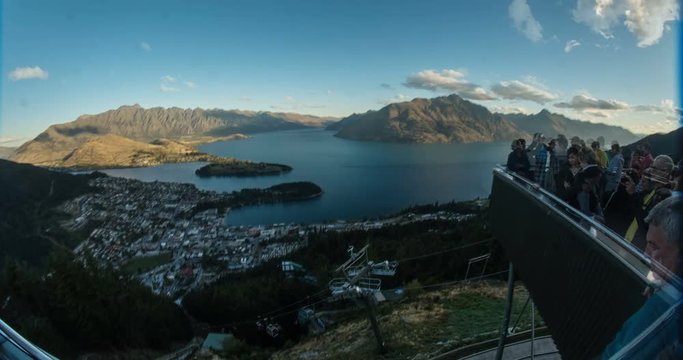 NEW ZEALAND – MARCH 2016 : Timelapse of viewing point over Queenstown at sunset with cityscape and light moving in view