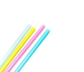 Four pied drinking straws on white background
