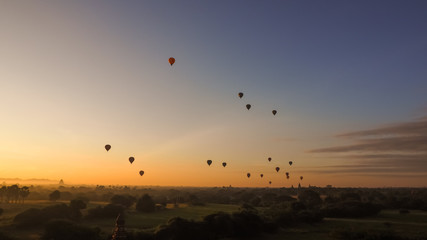 Balloons flying over Dhammayangyi Temple in Bagan Myanmar, Ballooning over Bagan is one of the most memorable action for tourists.