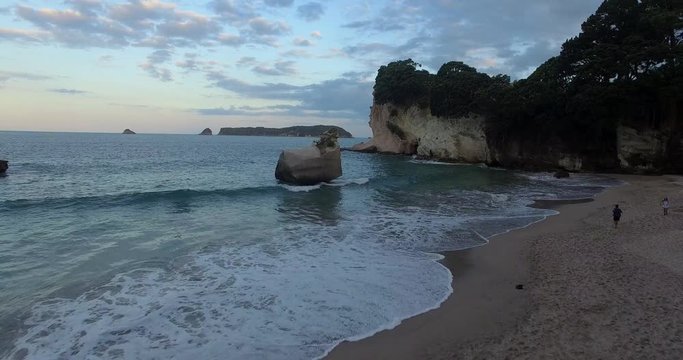 NEW ZEALAND &ndash; MARCH 2016 : Aerial shot over Cathedral Cove Beach at sunset with beautiful landscape in view