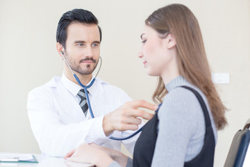 Doctor using stethoscope for listening woman. People with medical concept.