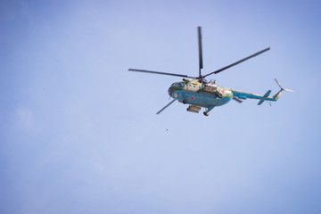 Fototapeta na wymiar military helicopters flying in the blue sky