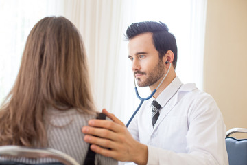 Doctor using stethoscope for listening woman. People with medical concept.