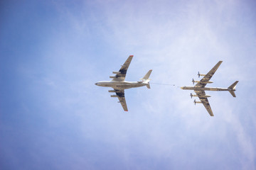 bombers fly in the blue sky