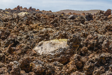 Volcanic rock from lava flow macro. Lava field in Timanfaya National Park in Lanzarote, Canary Islands, Spain.
