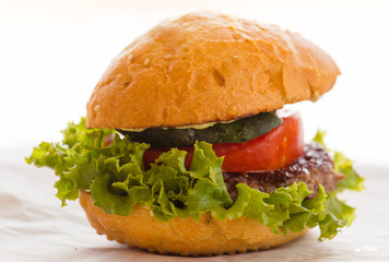 Large sandwich with tomato on the table