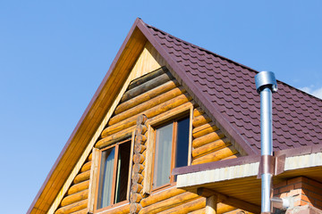 House with a log house in the nature