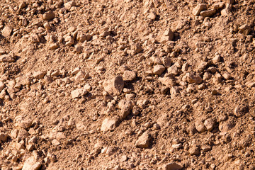 Red clay soil on nature as a background