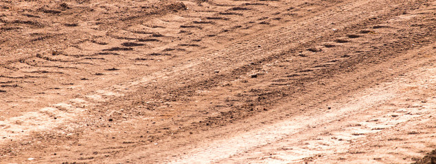 Traces from the car on the red clay soil