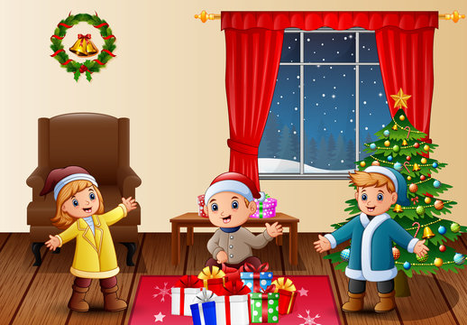 Happy kids in the living room with christmas and new year decoration