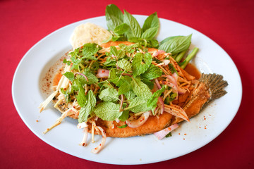 Deep fried Snake-head fish with Mixed Herb, Thai food - Pla Shon Lui Suan
