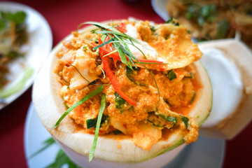 Steamed curry fish, shrimps and squid in coconut