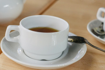 white Cup on table in cafe