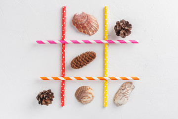 Game TIC TAC toe. Winter wins over summer. Seasonal conception. Top view, flat lay