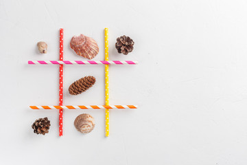 . Game TIC TAC toe. Winter wins over summer. Seasonal conception. Top view, flat lay with copy...
