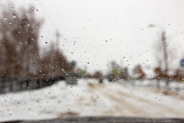 Drops on the car window in winter