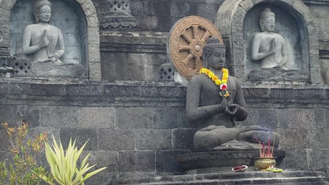 Statue of the Buddhist God Buddha in the Buddhist temple Brahma Vihara Arama with statues of the gods on Bali island, Indonesia. Bali Architecture, Ancient design. Travel concept.