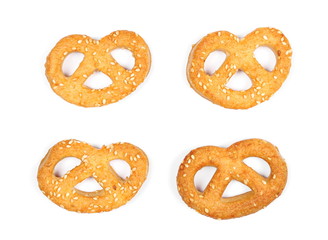 Salty handmade pretzels isolated on white background, top view