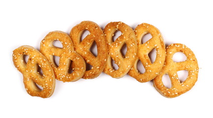 Salty handmade pretzels isolated on white background, top view