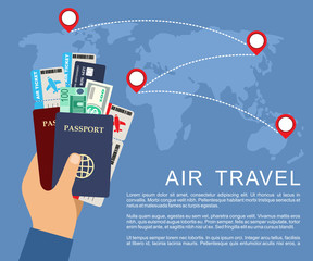 Hand holding airline tickets and passports. Air travel concept.