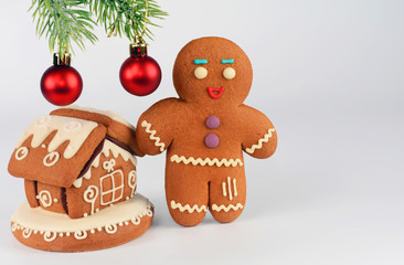 Gingerbread men and house on white background. Christmas or New Year composition. Christmas card.