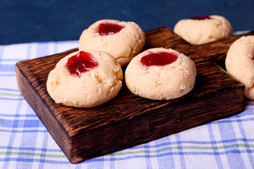 Cookies with jam, biscuits on a brown desk