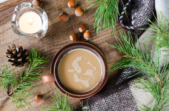 Hot cocoa, warm pleid and candle. Rustic life.