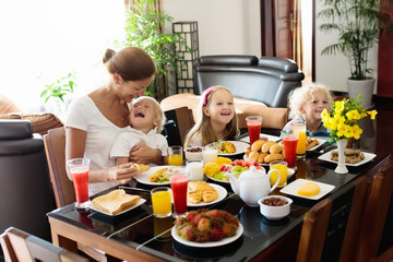 Healthy family breakfast for mother and kids.