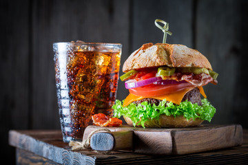Yummy hamburger with beef, cheese and vegetables