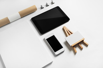 Brand identity template. Photo of blank stationery and gadgets on white paper background.