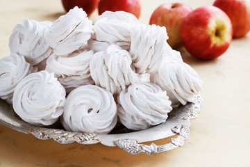 apple marshmallows in a metal bowl on a light background