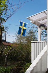 Swedish flag on a typical white house
