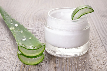 Macro of Slices of Aloe Vera with water drops and aloe gel very useful herbal medicine for skin care and hair care.