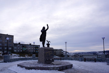 Monument to Waiting Woman  with sky background in Murmansk