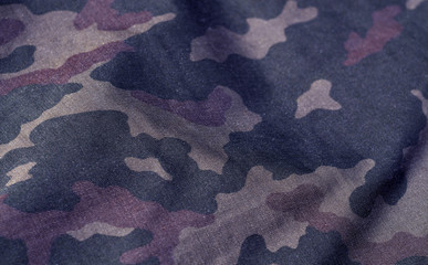 Blue and brown color military uniform pattern with blur effect. © pavelalexeev