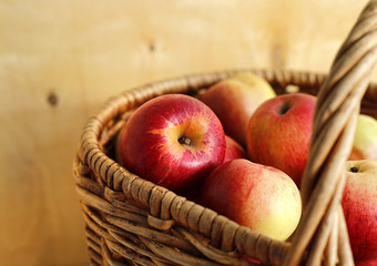 Tasty ripe apples in a basket, close-up