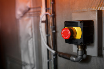 The red emergency button or stop button for Hand press. STOP Button for industrial machine, Emergency Stop for Safety.