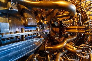 Gas turbine engine of feed gas compressor located inside pressurized enclosure, The gas turbine engine used in offshore oil and gas central processing platform.