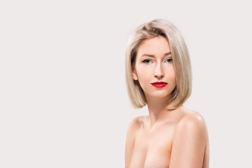 Obraz premium Portrait of beautiful female model on grey background