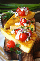 Corn polenta with Parmesan, roasted tomatoes, goat cheese