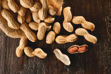 Composition of peanuts serving to make oil, peanut butter. Great for healthy and dietary nutrition. Concept of: condiments, dried fruit, food.