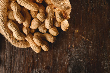 Composition of peanuts serving to make oil, peanut butter. Great for healthy and dietary nutrition. Concept of: condiments, dried fruit, food.