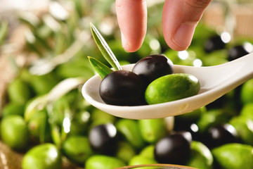 Genuine Italian organic oil cold pressed in slow motion falls on organic bread. concept of nature and healthy food, healthy and natural. fresh olives and Tuscan Italian oil